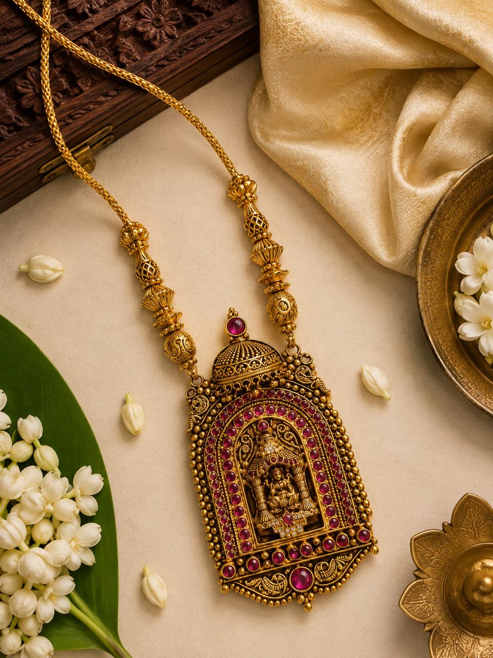 Kshetra temple necklace featuring intricate Goddess Lakshmi motif with ruby red stone accents