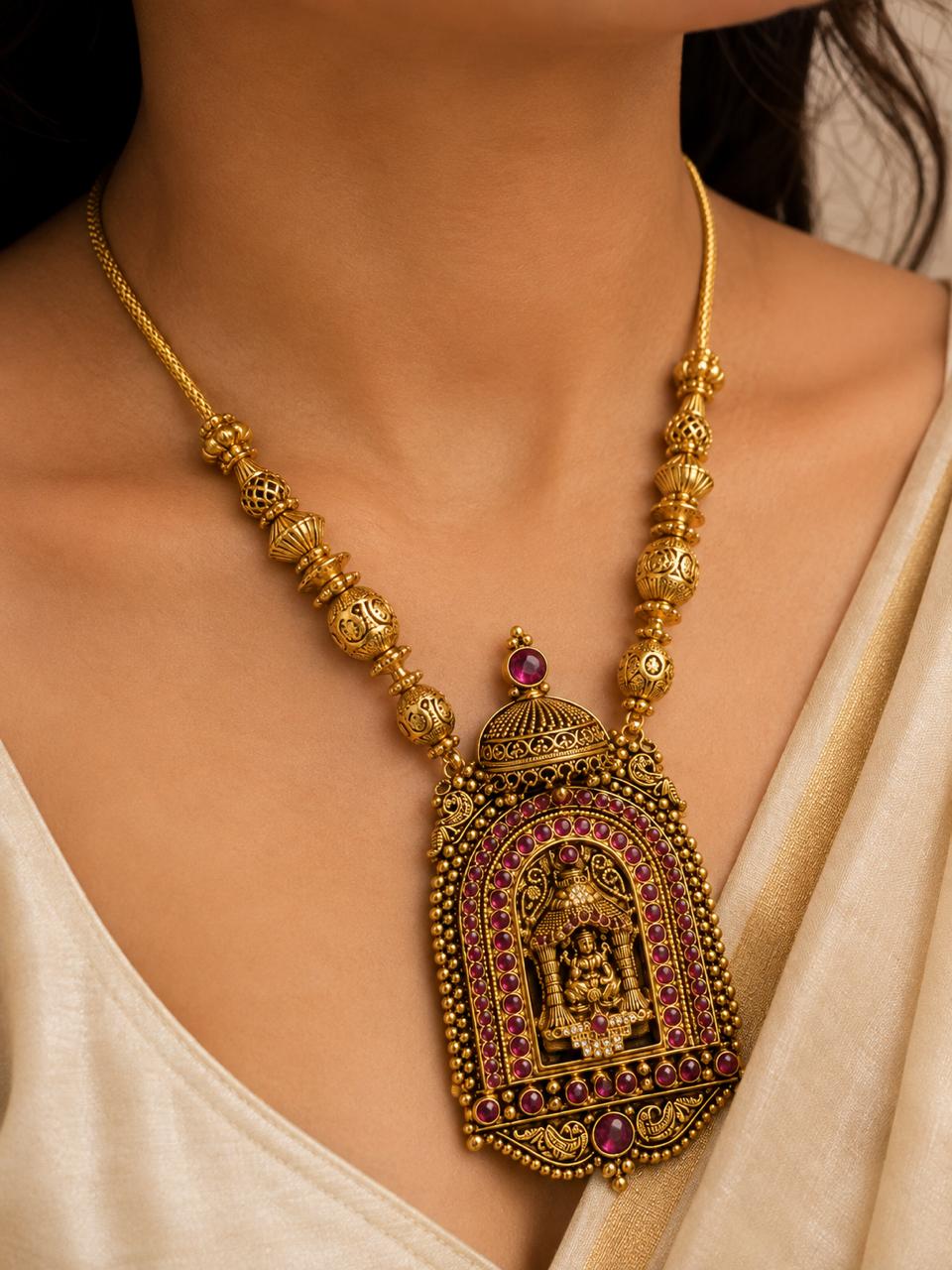 Traditional South Indian Kshetra temple necklace styled with silk bridal saree